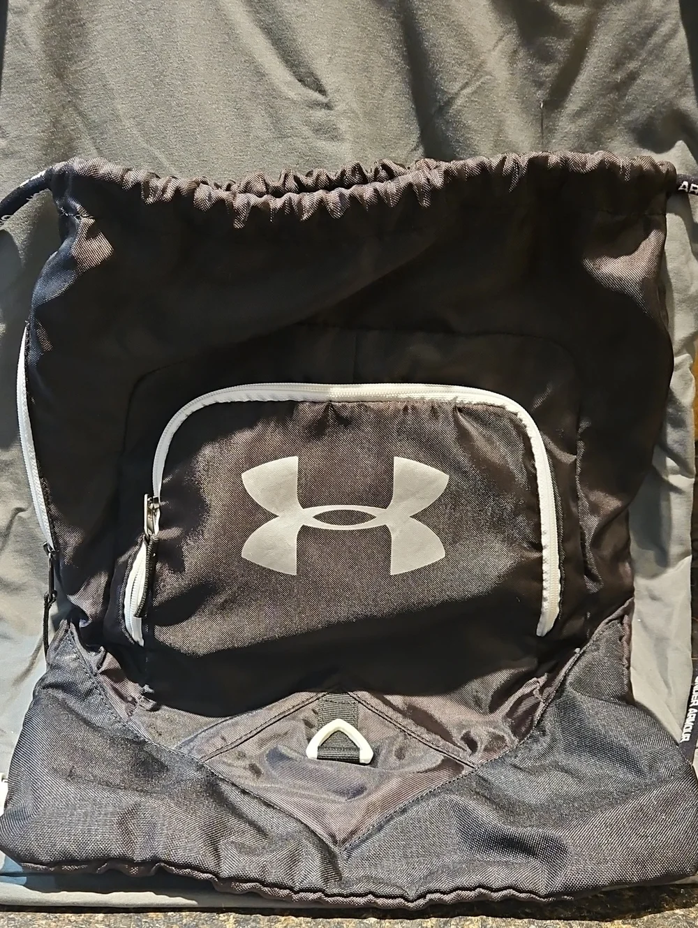 Under Armour Black Drawstring Backpack with White Trim and Front Pocket